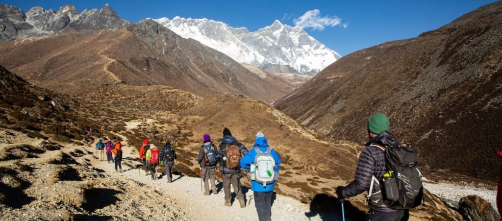 trekkers walking on the path of everest base camp trek
