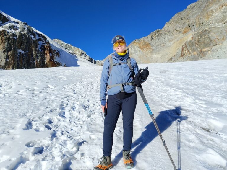 Hiker posing in snow at Cho La Pass during Everest base camp trek.