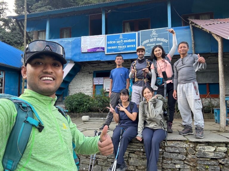 Group taking a selfie in front of Ghodepani Tourist Police Station.