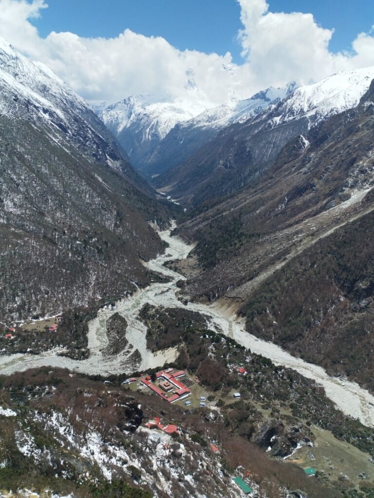 Aerial view of Himalayan valley with Lapchi-Shepung and Duldul caves and riverside settlement in Nepal
