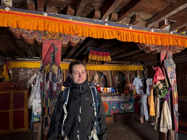Trekker inside Pungyen Gumba monastery on Nepal’s Manaslu Circuit trek
